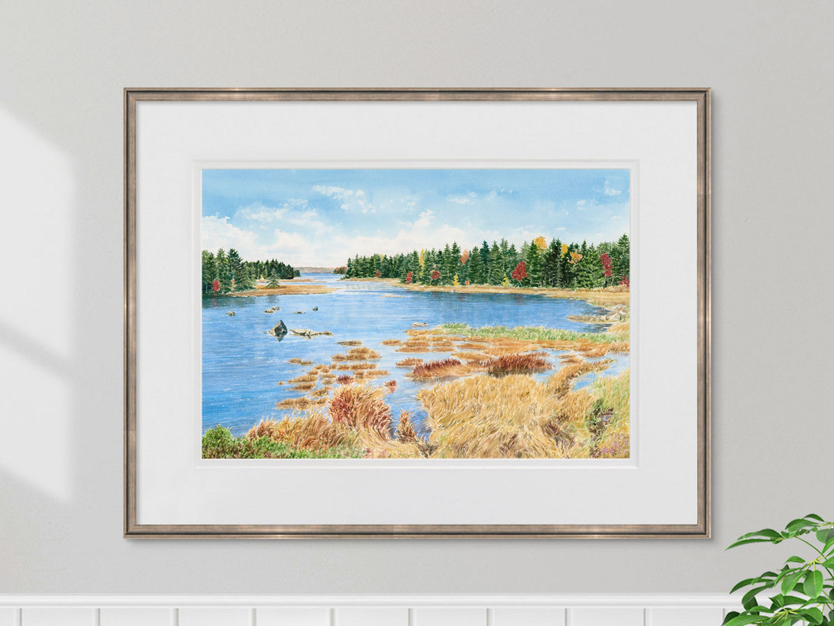 Framed original watercolor painting of Mt Desert Narrows, Acadia, Maine, in a muted gold frame over a coastal styled decor.