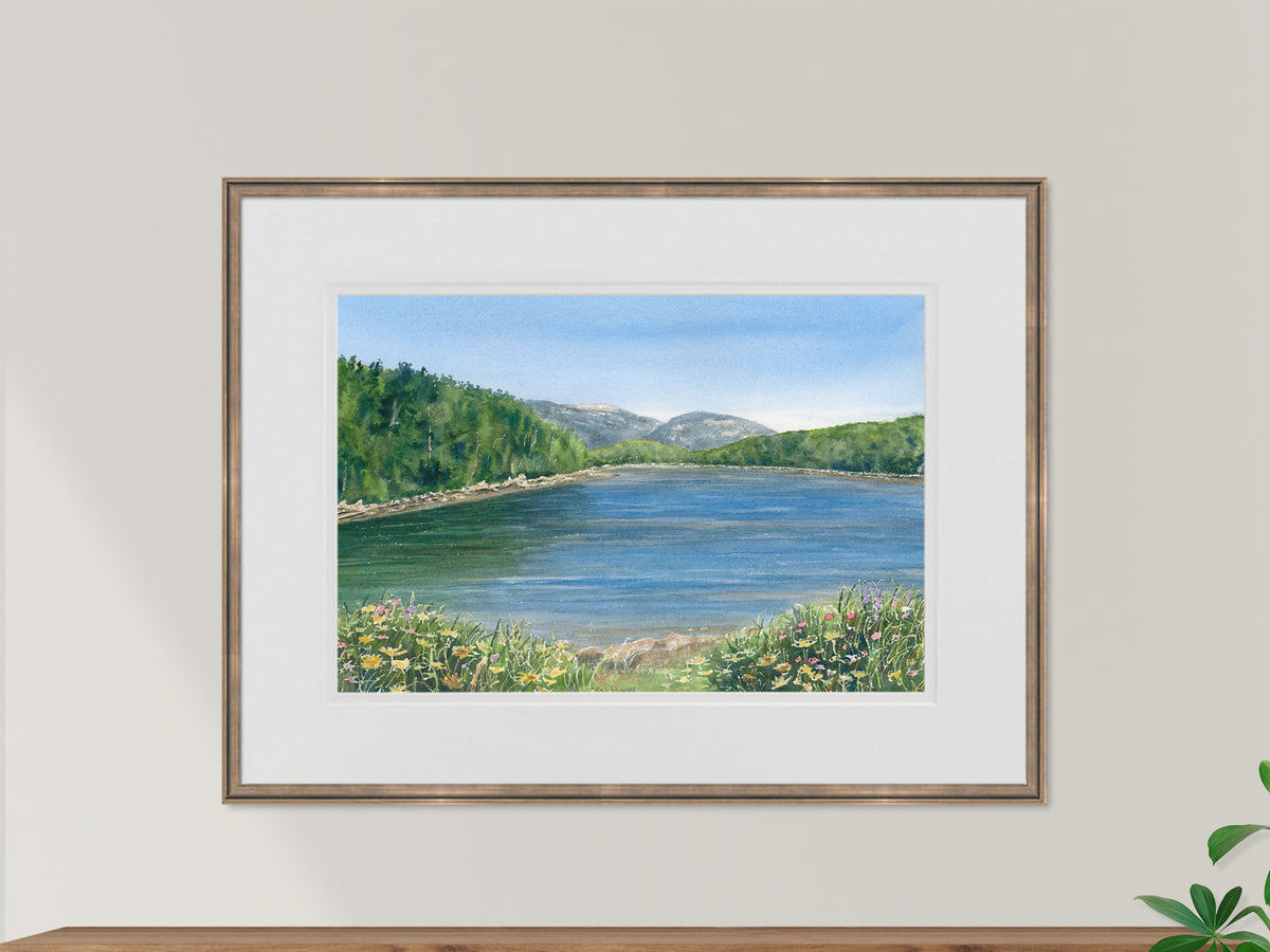 Framed original watercolor painting of Otter Creek Cove, Acadia, in a warm wood frame.