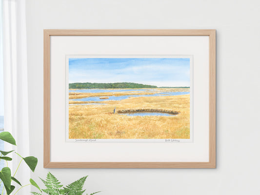 Framed watercolor print of Scarborough Marsh, Southern Maine, in a warm wood frame with lush plant styling.
