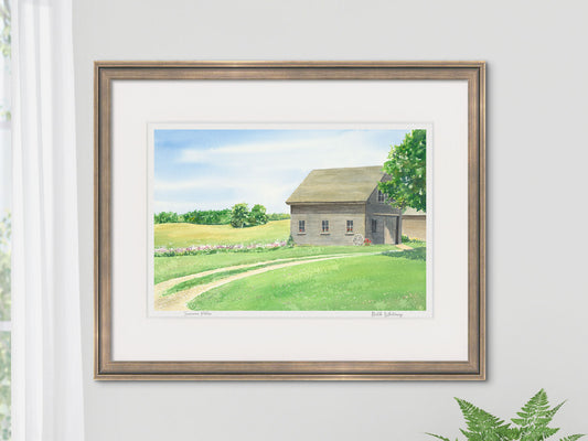 Framed watercolor print of Summer Phlox, Salsbury Cove, Maine, in a gold frame beside a window with fern styling.