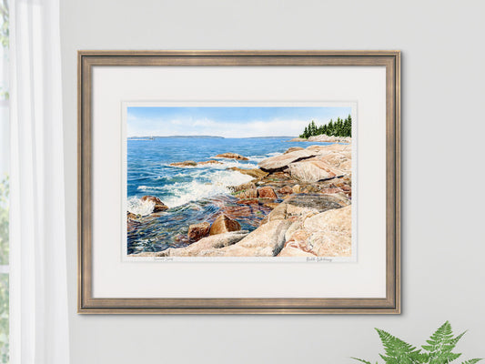 Framed watercolor print of Sunset Surf, East Penobscot Bay, Maine, in a gold frame on a neutral wall.