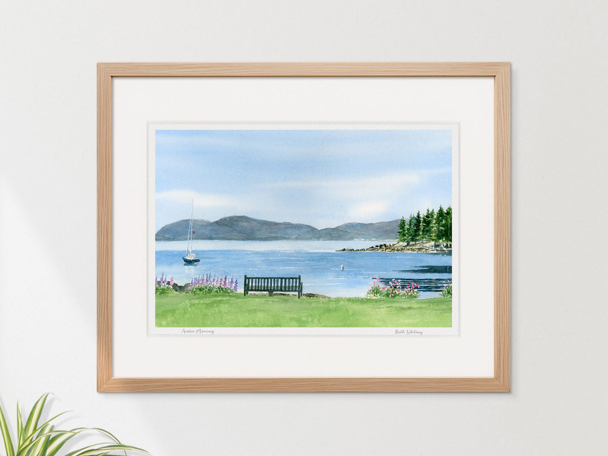 Framed watercolor print of Acadia Morning, Frenchman's Bay and Acadia National Park, shown in a neutral wood frame.