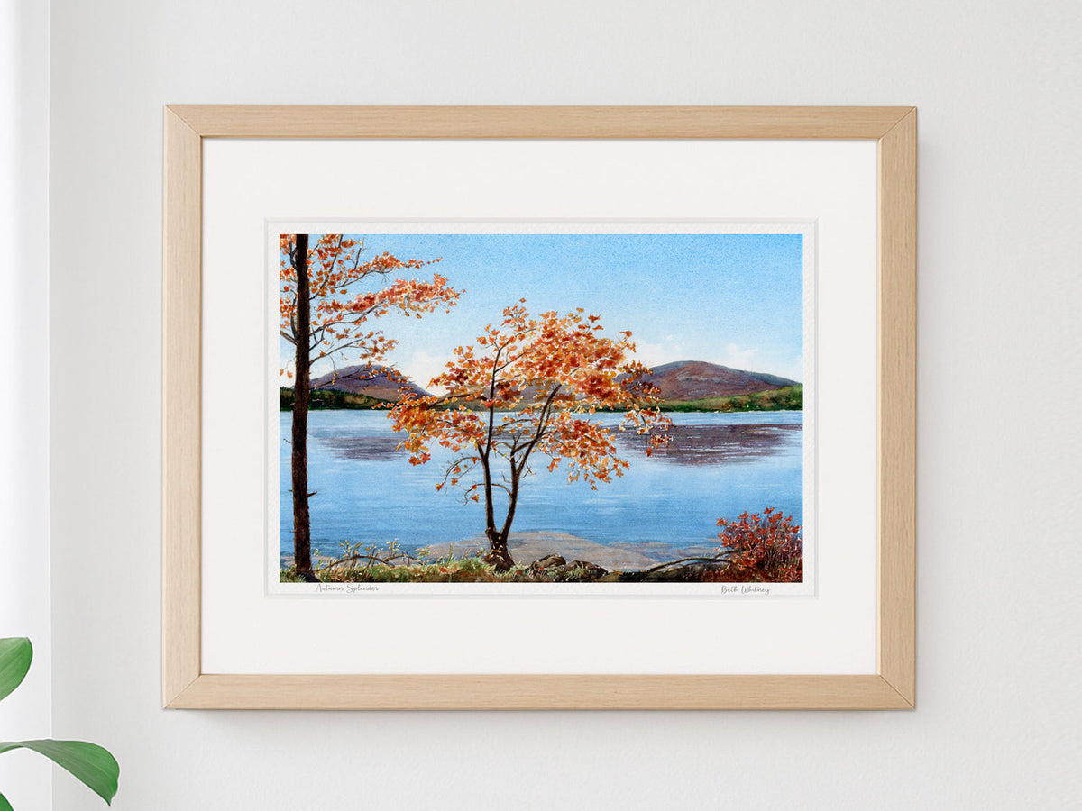Framed watercolor print of Autumn Splendor, Eagle Lake fall foliage, Acadia National Park, in a warm wood frame.