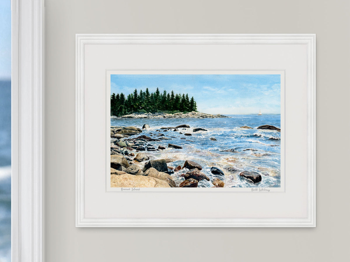 Framed watercolor print of Barred Island rocky shore, Sunset, Maine, on a neutral wall.