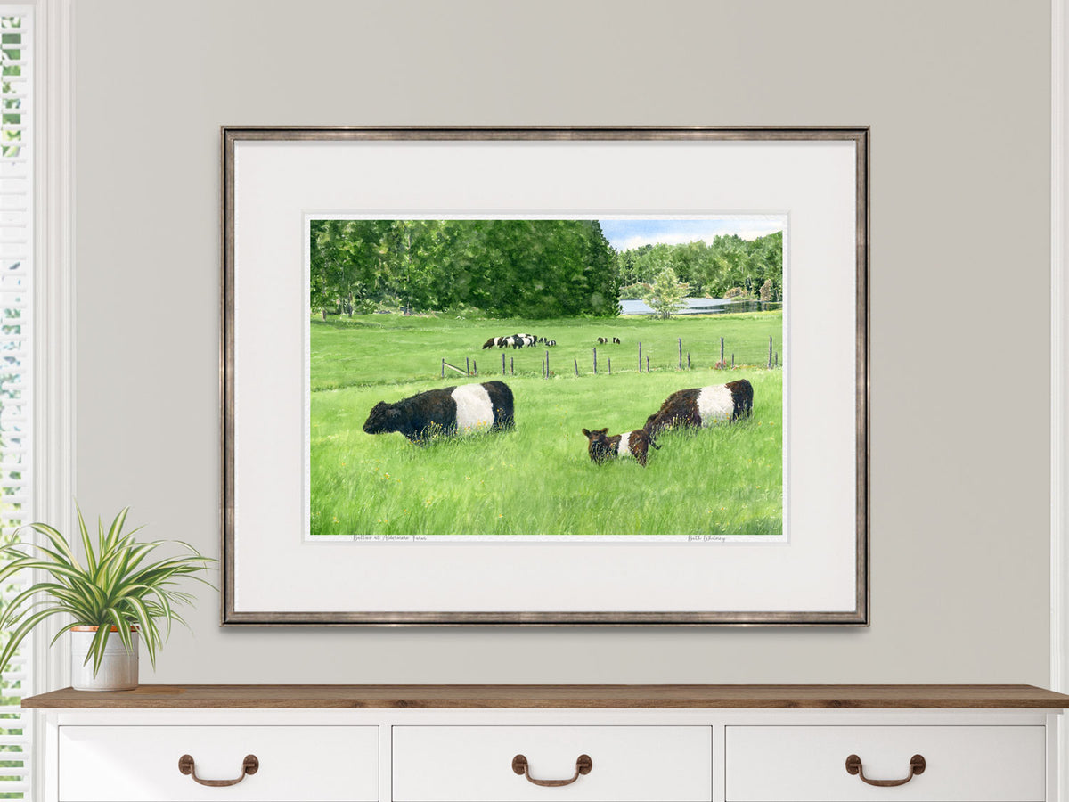 Framed watercolor print of Belties at Aldermere Farm, Rockport, Maine, displayed above a dresser in a neutral interior.