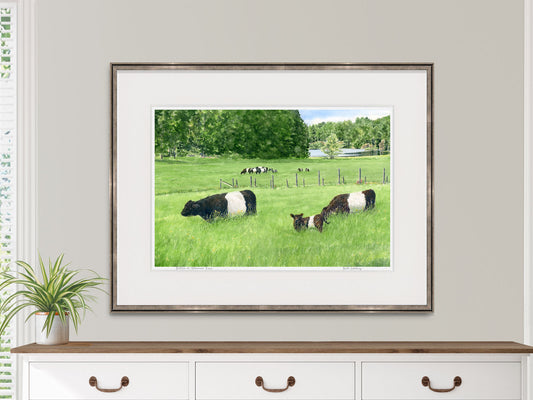 Framed watercolor print of Belties at Aldermere Farm, Rockport, Maine, displayed above a dresser in a neutral interior.