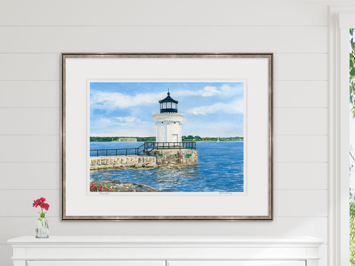 Framed watercolor print of Bug Light, Portland Breakwater Light, in a warm wood frame with flower styling.