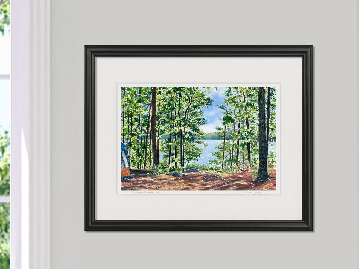Framed watercolor print of Camping at Sebago Lake in a black frame on a neutral wall.