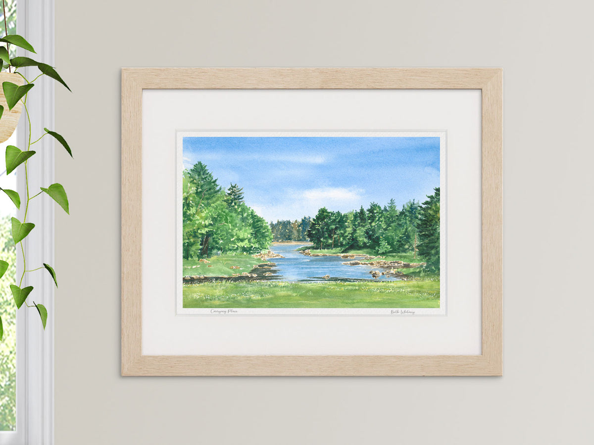 Framed watercolor print of Carrying Place, Machias, Maine, in a warm wood frame with plant styling.