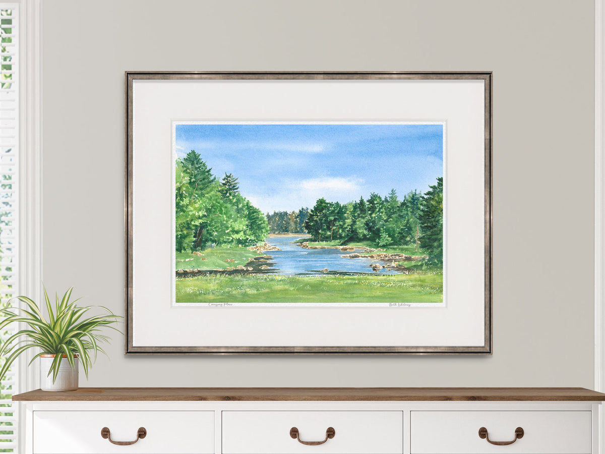 Framed watercolor print of Carrying Place, Machias, Maine, displayed above a dresser in a lifestyle setting.