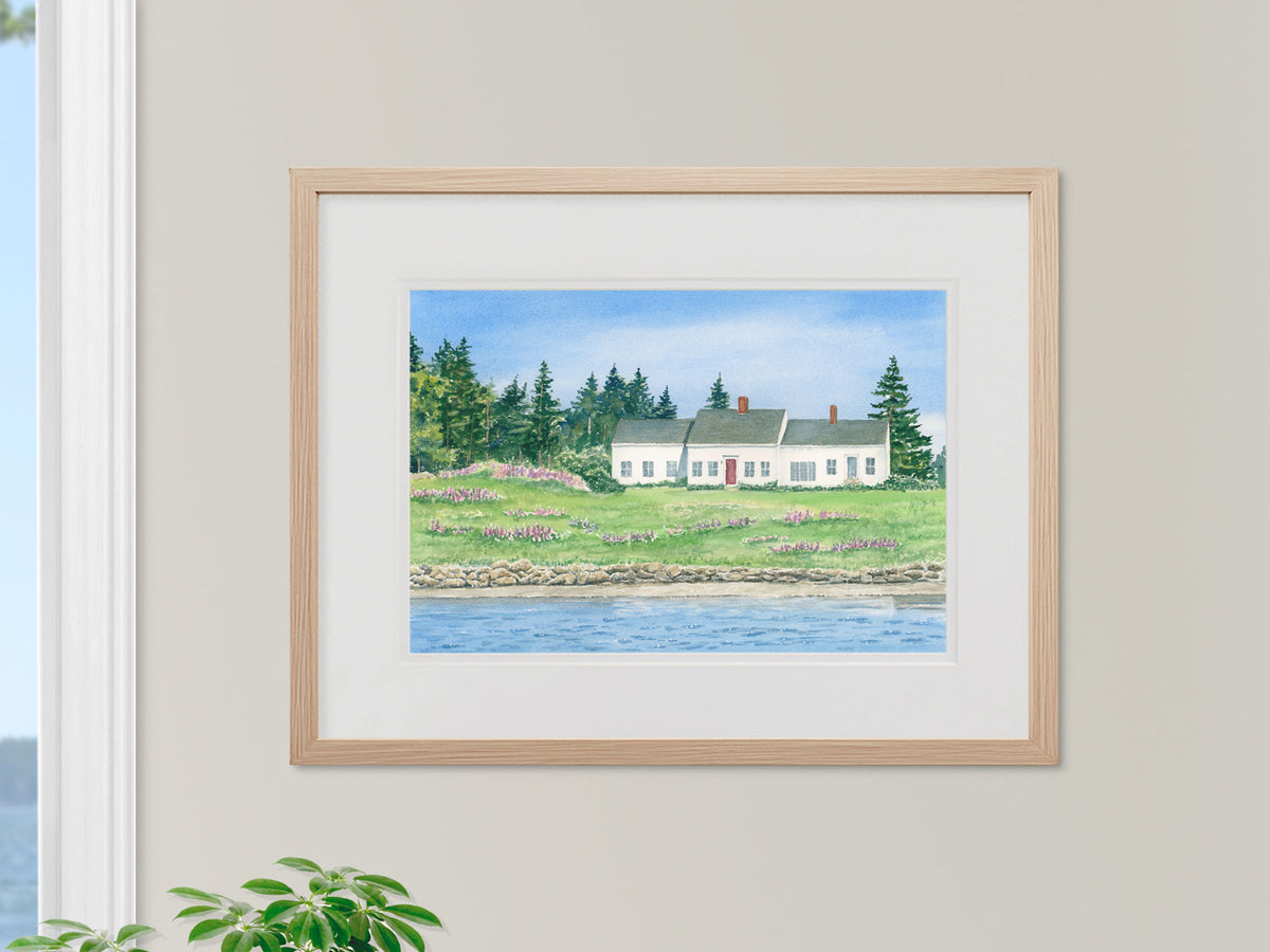 Framed original watercolor painting of Cottage on Vinalhaven in a warm wood frame.