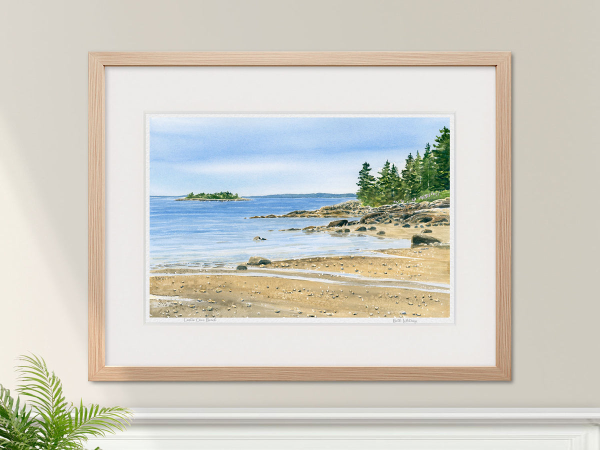 Framed watercolor print of Curtis Cove Beach, East Blue Hill, in a warm wood frame with botanical styling