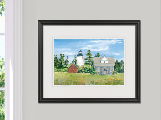 Framed watercolor print of Dice Head Light, Castine, Maine, in a black frame on a neutral wall.