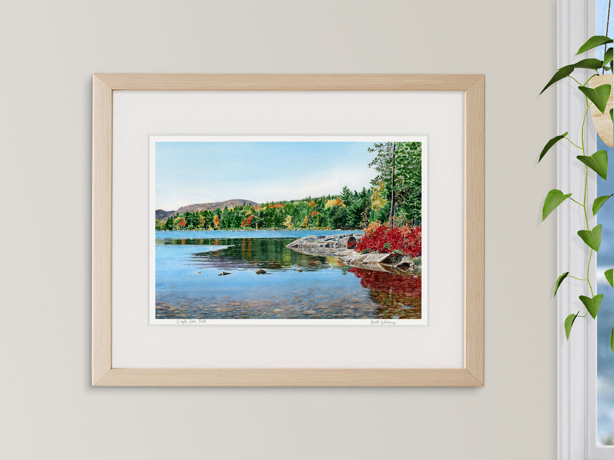 ramed watercolor print of Eagle Lake Fall, Acadia, in a white frame with plant styling.