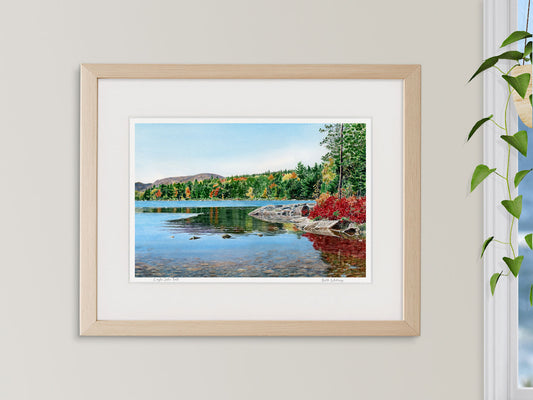 ramed watercolor print of Eagle Lake Fall, Acadia, in a white frame with plant styling.