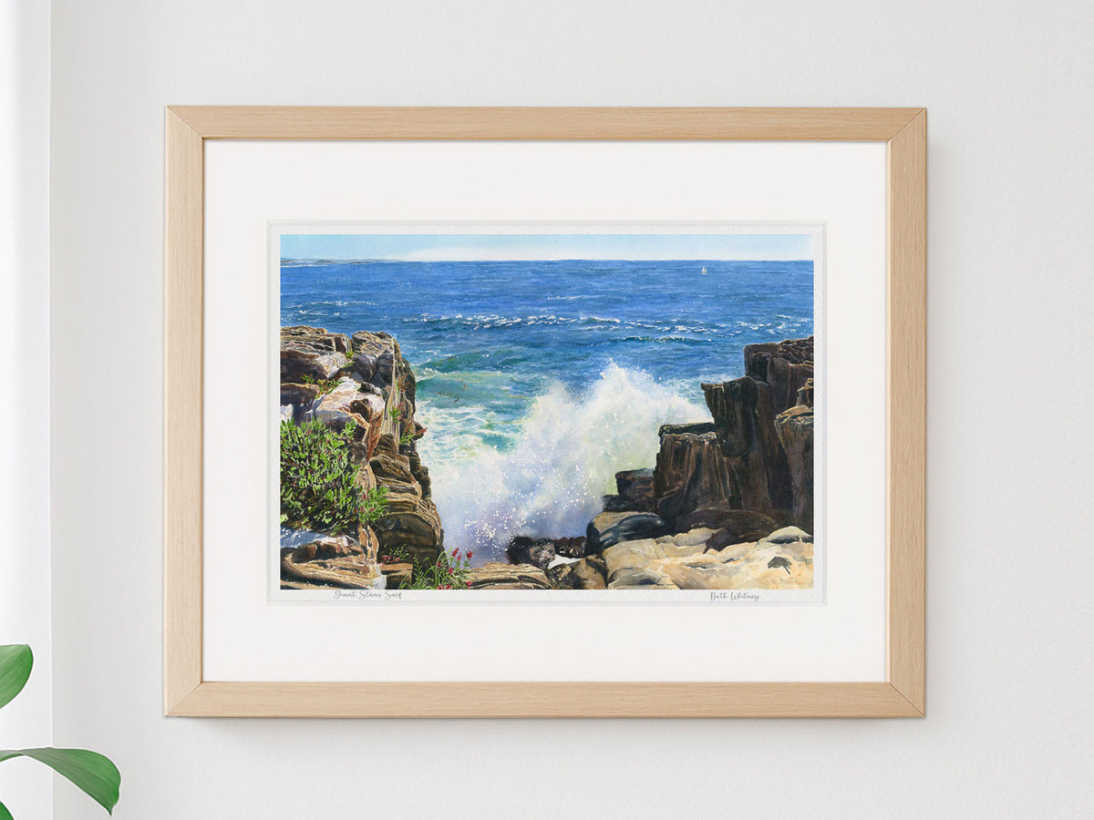 Framed watercolor print of Giant Stairs Surf, Bailey Island, in a warm wood frame on a neutral wall.