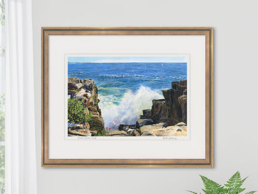 Framed watercolor print of Giant Stairs Surf, Bailey Island, in a warm wood frame on a neutral wall.