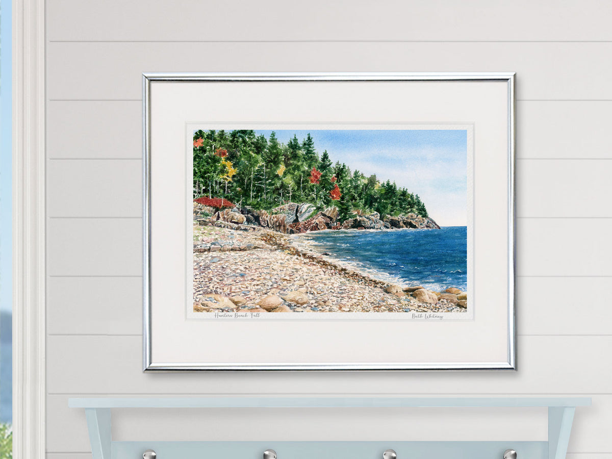 Framed watercolor print of Hunters Beach Fall, Seal Harbor, in a white frame on a neutral wall.