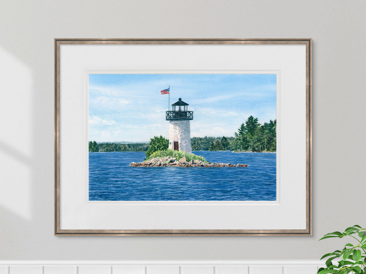 Framed original watercolor painting of Ladies Delight Light, Lake Cobbosseecontee, in a pale gold frame.