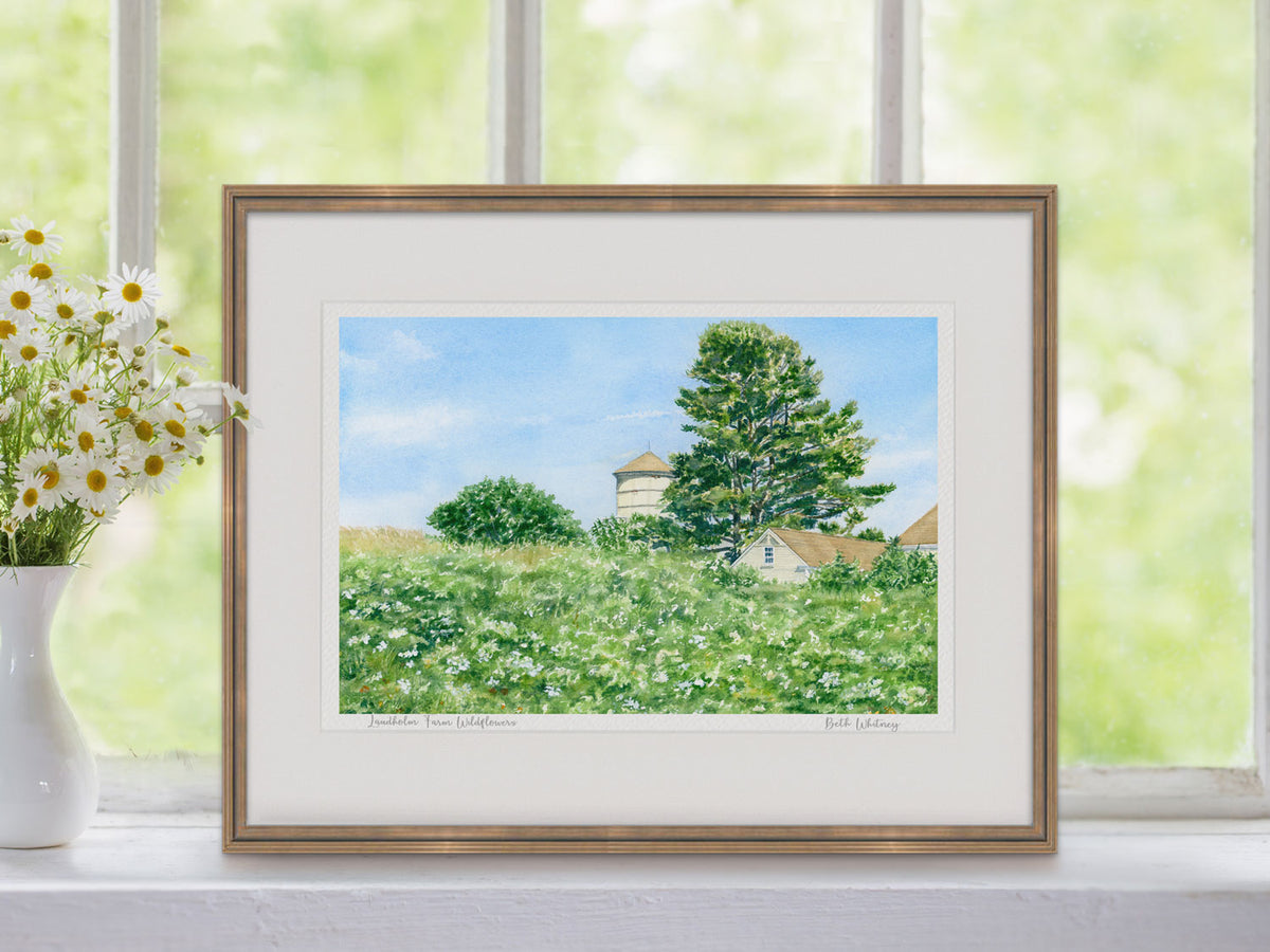 Framed watercolor print of Laudholm Farm Wildflowers, Wells Reserve, Maine, in a warm wood frame with flower styling.
