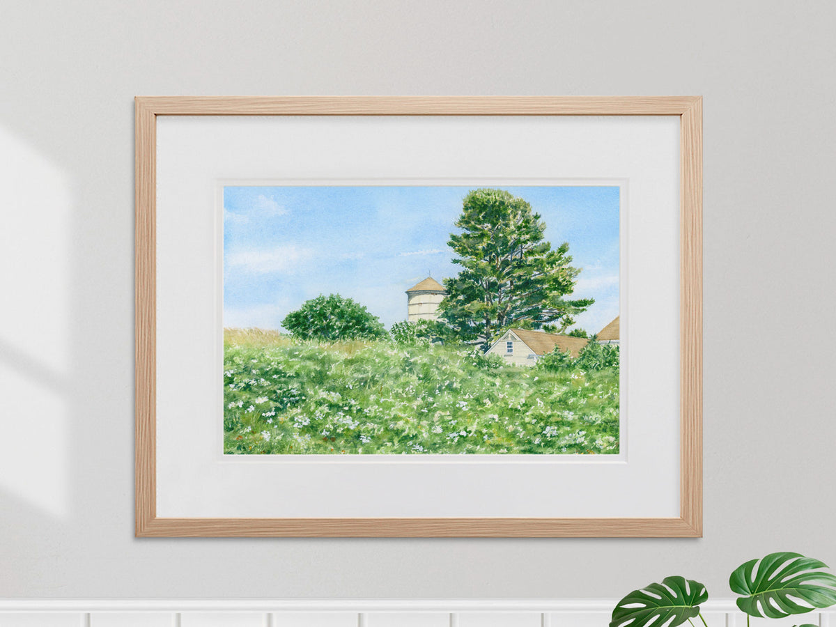 Framed original watercolor painting of Laudholm Farm Wildflowers in a warm wood frame.