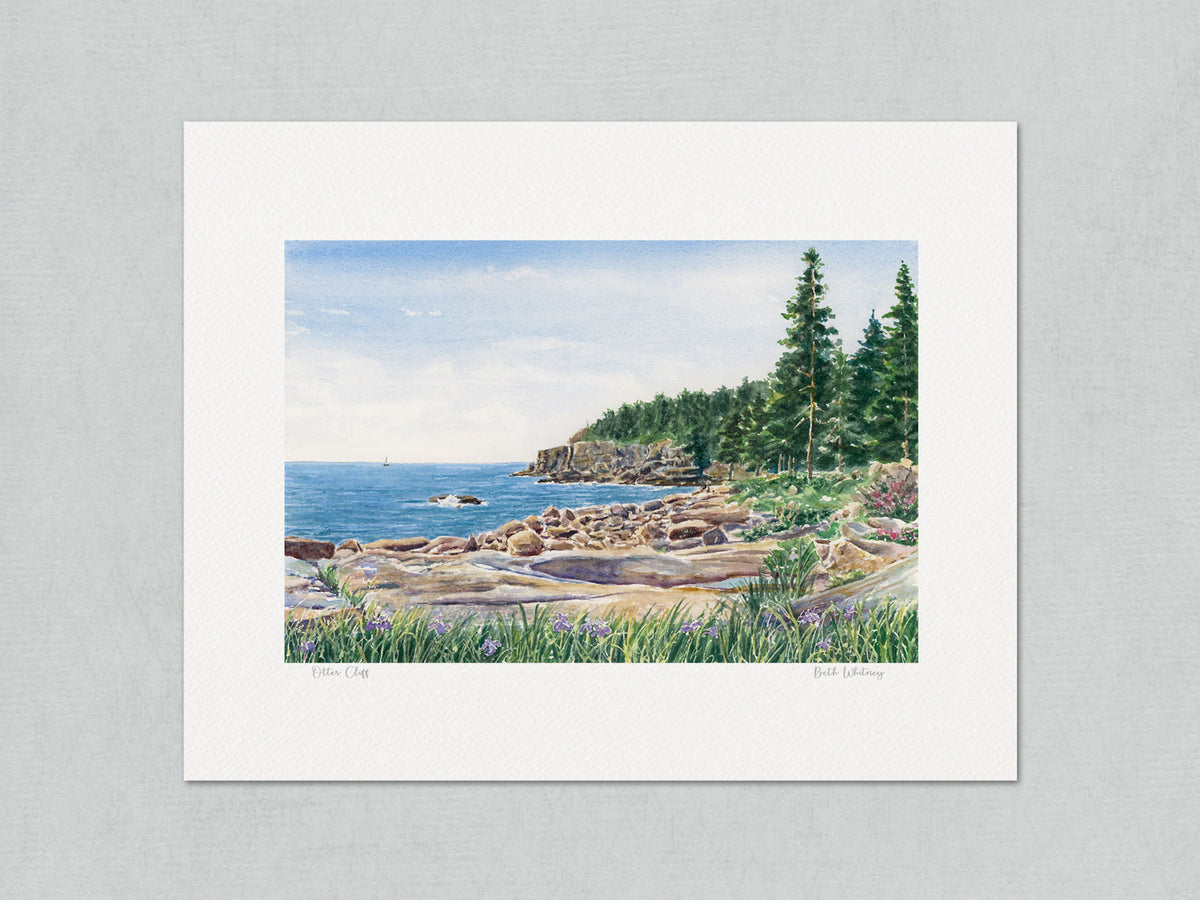 Unmatted archival watercolor print of Otter Cliff, Acadia National Park, Maine, showing artist's signature and painting title, on gray background.