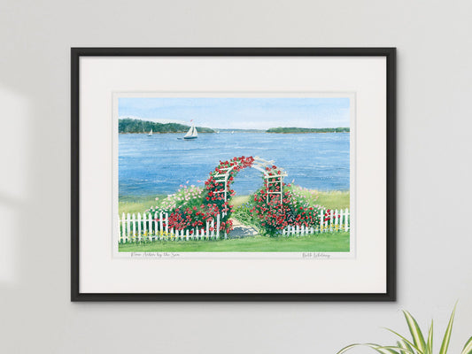 Framed watercolor print of Rose Arbor by the Sea, Penobscot Bay, Maine, in a contemporary black frame on a neutral wall.