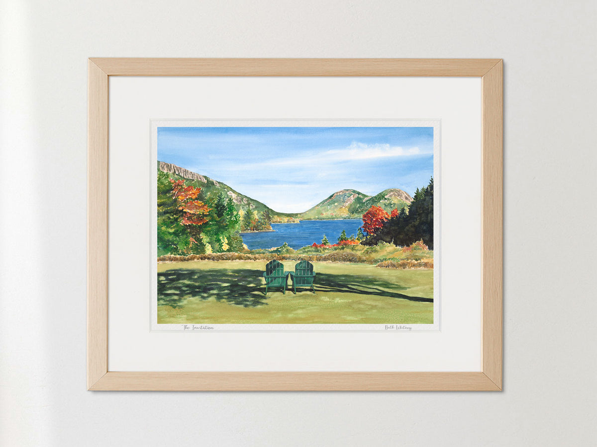 Framed watercolor print of The Invitation, Jordan Pond, Acadia National Park, in a warm wood frame on a neutral wall.