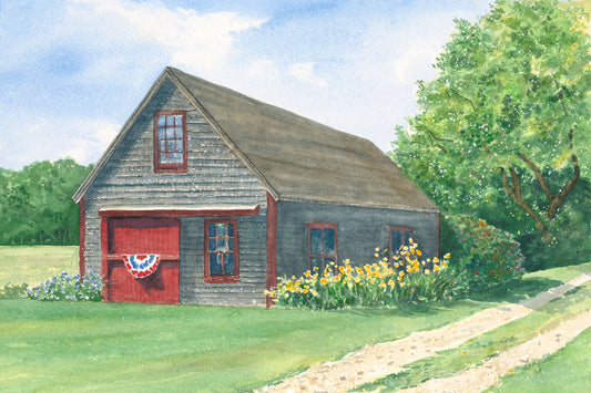 Original watercolor painting of a rustic gray barn with red door, patriotic banner, and yellow flowers in Friendship, Maine, by Beth Whitney.