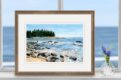 Deer Isle, Maine watercolor painting of rocky island shore and crashing ocean surf. Shown as shelf decor.