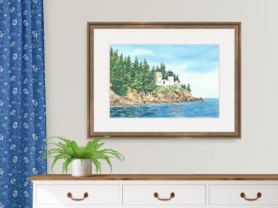 Watercolor painting of Bass Harbor lighthouse in Maine showing calm ocean, rocky cliff, and pine trees