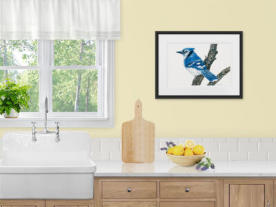Watercolor painting of a blue jay on a branch with a white background