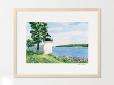 White lighthouse surrounded by lupine and wildflowers, trees, overlooking the water.