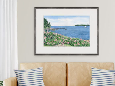 Coastal living room with Spruce Point print in the background.